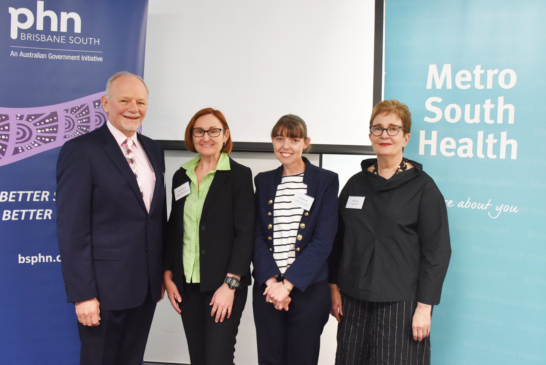 Formal photo of Brisbane South PHN Board Chair, Dr Ian Williams, Anglicare's Annabelle Smith and Michelle Gibb and Metro South Health Board Director, Helen Darch.