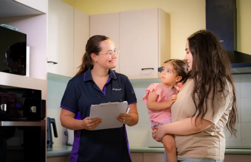 Family support worker supporting a mother and son in their home