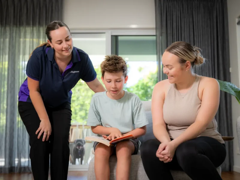 Anglicare family mental health support worker assisting mother and child in home