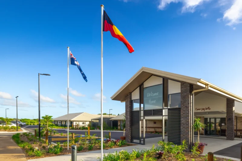 Anglicare Southern Queensland Residential Aged Care home exterior with Aboriginal flag raised.