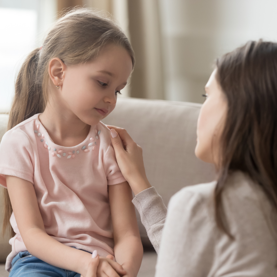 Mother consoling her young daughter after witnessing domestic and family violence