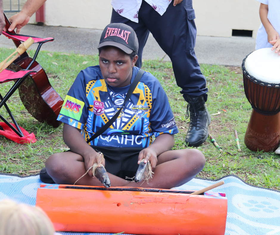 Young First Nations boy playing instrument for Jarjums event