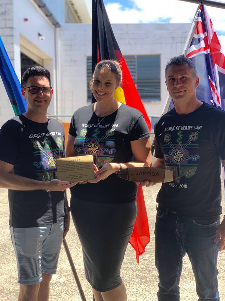 Anglicare staff holding a plaque for the Logan Office Naming Ceremony
