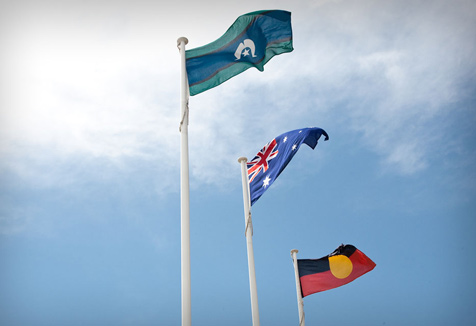 Aboriginal Flag, Torres Strait Islander Flag and Australian Flag flying high