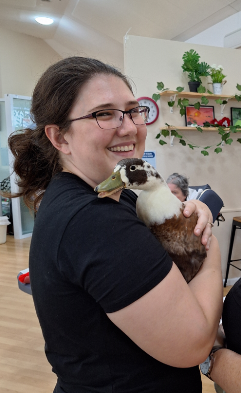 Lorna, Diversional Therapist, holding a duck.