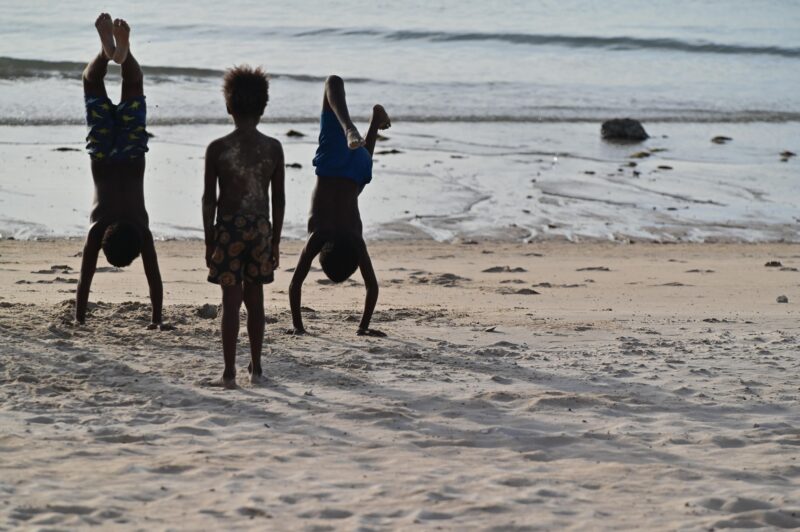 Torres Strait Islander children playing on a beach
