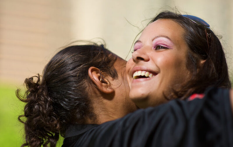 Carer hugging foster daughter