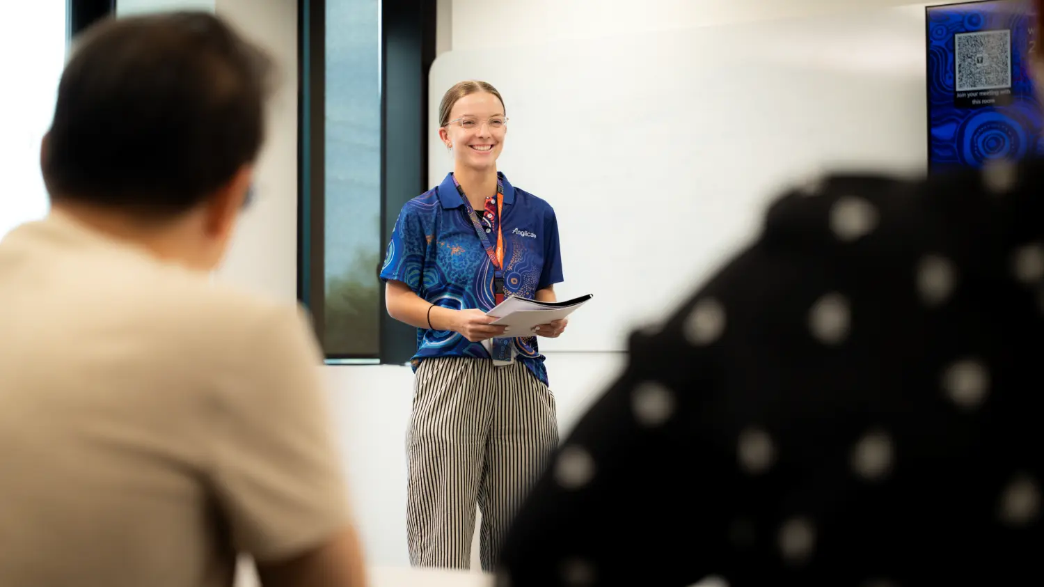 Anglicare staff members in office working on Anglicare's strategic plan